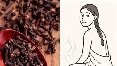 سر القرنفل المطحون مع كوب حليب 